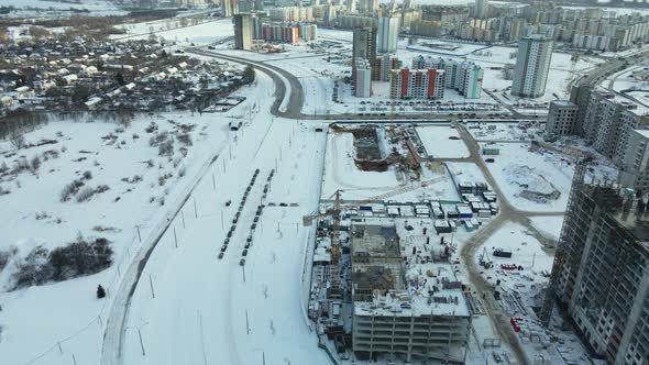 Construction site of a modern city block. High-rise buildings under construction.