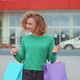 Young Woman with Shopping Bags Walking Outside Shopping Mall - VideoHive Item for Sale