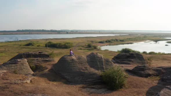 A Girl Does Sports at Sunset on the Shore of the Lake alt