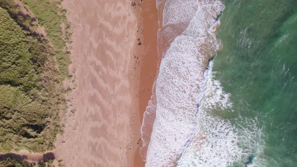 A Beautiful Secluded Beach Seen From a Bird's Eye View alt