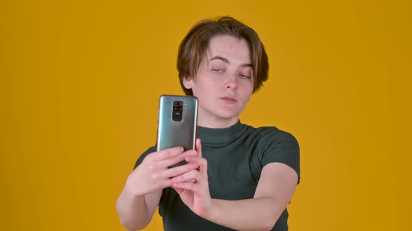 Young brunette girl posing doing selfie shot
