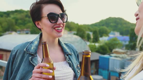 Young Women Drinking Beer Outdoors, Having Fun Outdoors alt