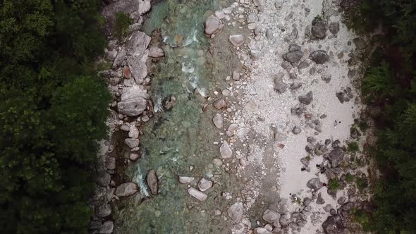 Top Down Aerial View of Rocky Mountain River Stream in Switzerland - Bird's Eye Drone alt