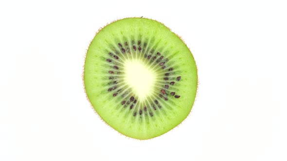Kiwi fruit isolated on white background, rotate. 4K UHD video alt