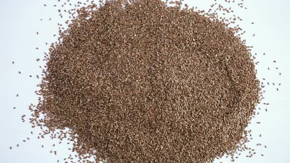 Flax seeds on painted wood board alt