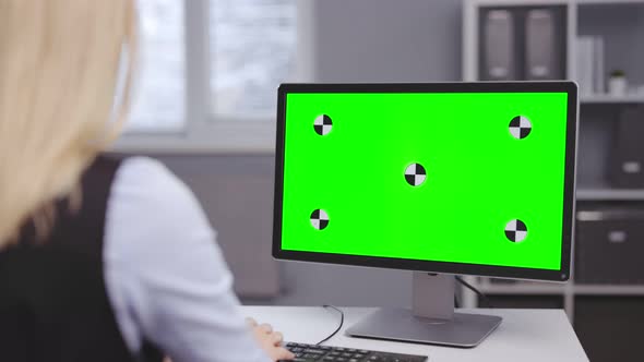 Woman Using Green Screen Computer