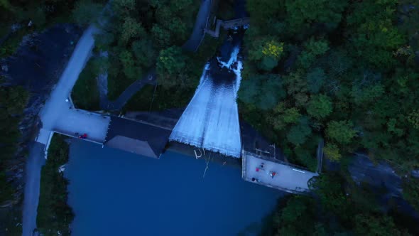 Cascading Waters from Reservoir In Klammsee Lake In Kaprun Austria - Aerial Shot alt