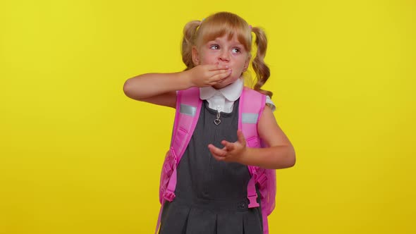 Frightened School Girl Closing Her Mouth with Hand Looking Intimidated Scared at Camera Gestures No alt