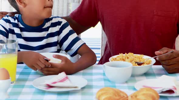 Father and son having breakfast 4k alt