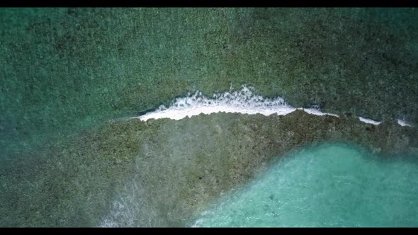 Aerial drone view travel of relaxing island beach voyage by blue lagoon and white sand background of alt