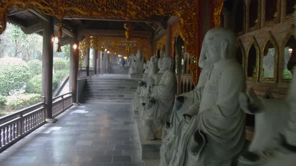 Row Of Buddha Statue In Bai Dinh Pagoda Temple. A Popular Site For Buddhist Pilgrimages In Ninh Binh alt