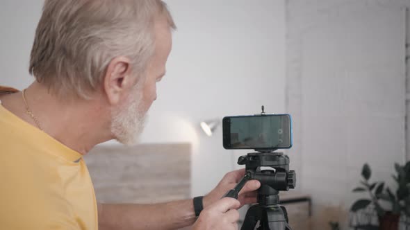 Grandfather and Technology, Elderly Male Blogger Is Influential Ready To Use His Smart Phone for alt