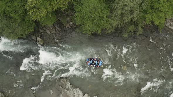 Group of people rafting in a river in Tuscany, Italy