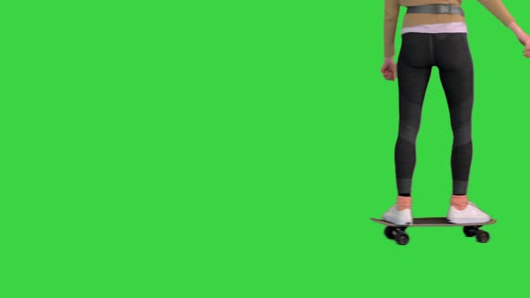 Female Legs on Skateboard Riding By on a Green Screen Chroma Key