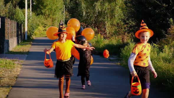 Children in Costumes are Celebrating Halloween alt
