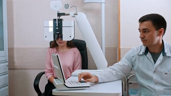 Young Woman Visiting Children's Doctor in Eye Clinic alt