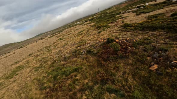 FPV Racing Drone Flying Over an Open Field on Madeira Portugal alt