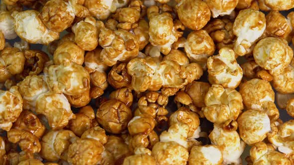 Coffee taste popcorns falls close up. Caramel popcorn. Healthy food for morning breakfast. Healthy alt
