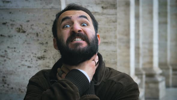 young latin man strangling himself. Sign,gesture,suicide alt