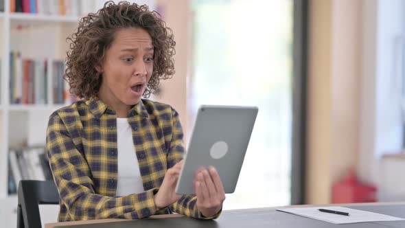 Loss Young Mixed Race Woman Reacting to Failure on Tablet alt