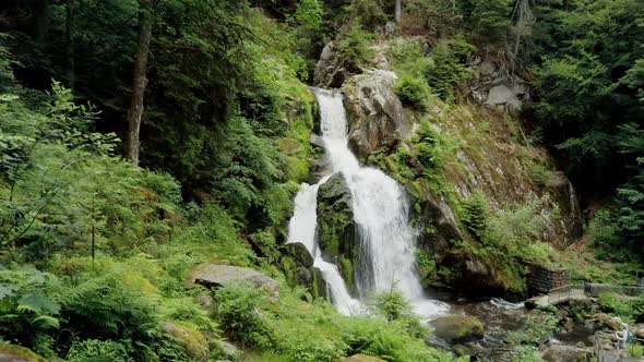 POV Walking Toward Beautiful Waterfall in Forest Wilderness alt