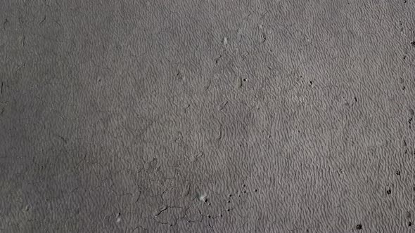 Top View Dry Shore Full of Clay of Dried Up Sea Global Warming and Drought Concept alt