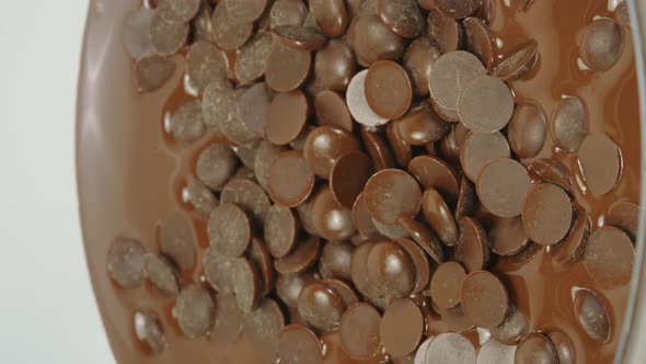 Vertical Shot Closeup Melting Natural Organic Dark or Milk Chocolate Zoom in Homemade Candies