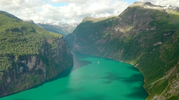 Scenic View Of Geiranger Fjord And Mountains In Norway. - aerial alt