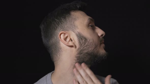 Man Preparing To Shave His Beard with Electric Razor alt