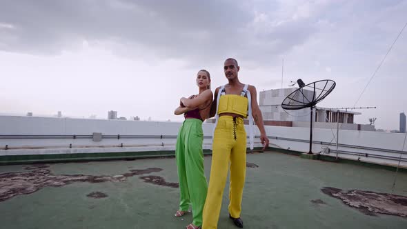 Models In Clubwear Dancing And Performing Together On Skyscraper alt
