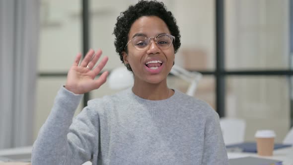 Portrait of Young African Woman Waving, Welcoming alt