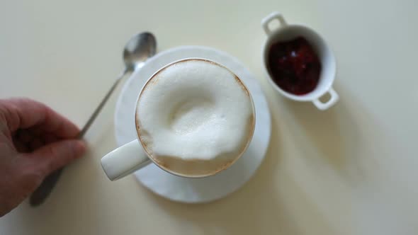 large cup of cappuccino coffee with milk foam