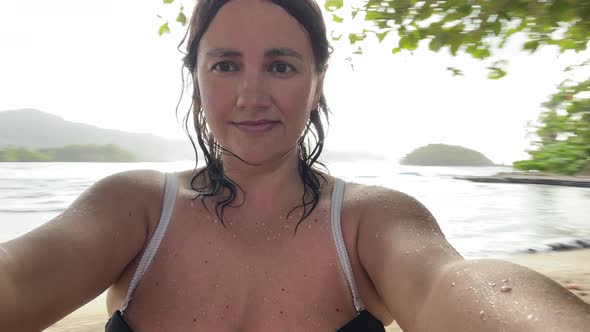 Young Beautiful Woman in Bikini Having Fun on the Beach Making Selfie on Mobile Phone
