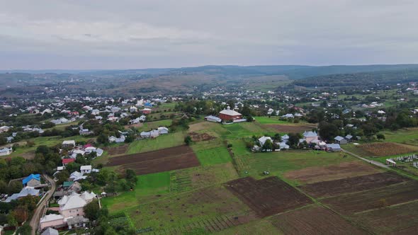 Flight over the houses in the Ukrainian village Aerial view.