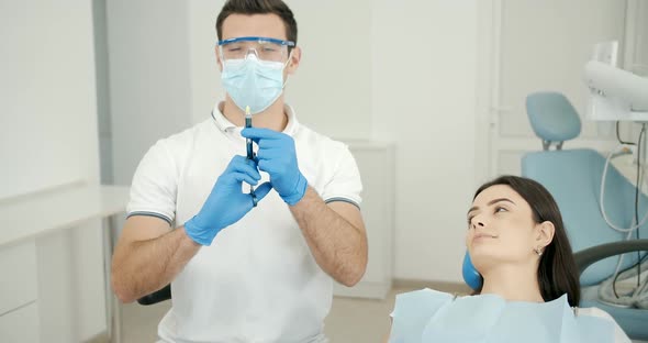 Dentist Making Anesthesia To Patient