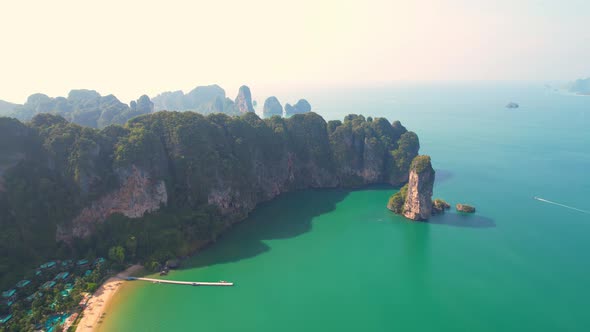 4K aerial view of the beautiful mountain coast of the tropical sea alt