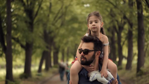 Father's Day. Kid Having Fun In Park. Carefree Dad With Preschool Daughter Enjoy Activity Together. alt