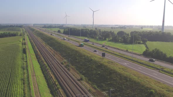 Overhead View of Cars Driving on a Highway Next to a Railroad During Summer in Belgium Europe alt