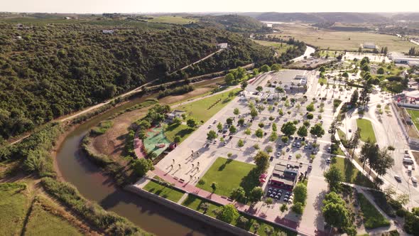 Aerial view of the Municipal pools of Silves complex surrounded by Arade River. alt