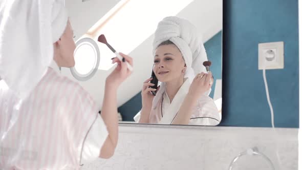 Attractive Woman Applying Cream on Skin Under Eyes at Home