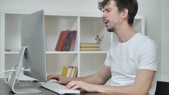 Loss, Frustrated Creative Man Working on Desktop alt