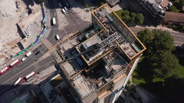 High Angle View of Top of Skyscraper with Crane and Scaffolding alt