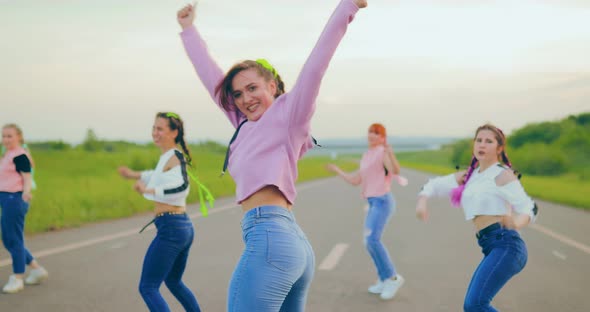 Street Dancing in the Summer on the Road. Cute Girls Dancing Hip-hop. Portrait View alt