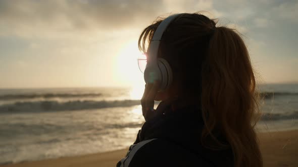 Listening To Music On The Beach alt