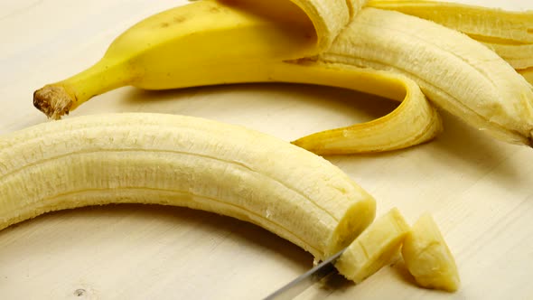 Ripe banana is cutting into thin slices