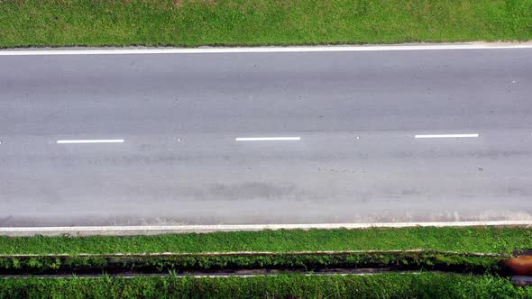 Aerial view of a lonely deserted two-lane country road