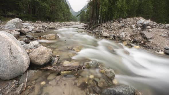 Arshan Mountain River Water in a Mountain River Like Foam, Long Exposure. Timelapse. alt