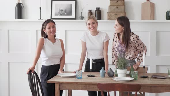 Close up View of the Camera Portrait Three girls look at the camera communicate smile stand alt