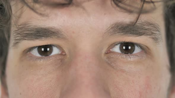 Close Up of Blinking Eyes of Young Casual Man alt