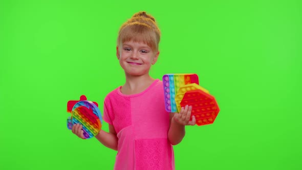 Child Girl Kid Holding Many Colorful Squishy Silicone Bubbles Sensory Toy Kid Playing Pop It Game alt